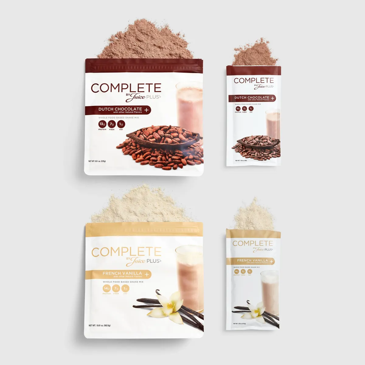Four packages of Juice Plus+ Complete Food Variety Shakes, two with chocolate flavor and two with vanilla flavor. Each package has an image of ingredients like chocolate chips and vanilla pods.