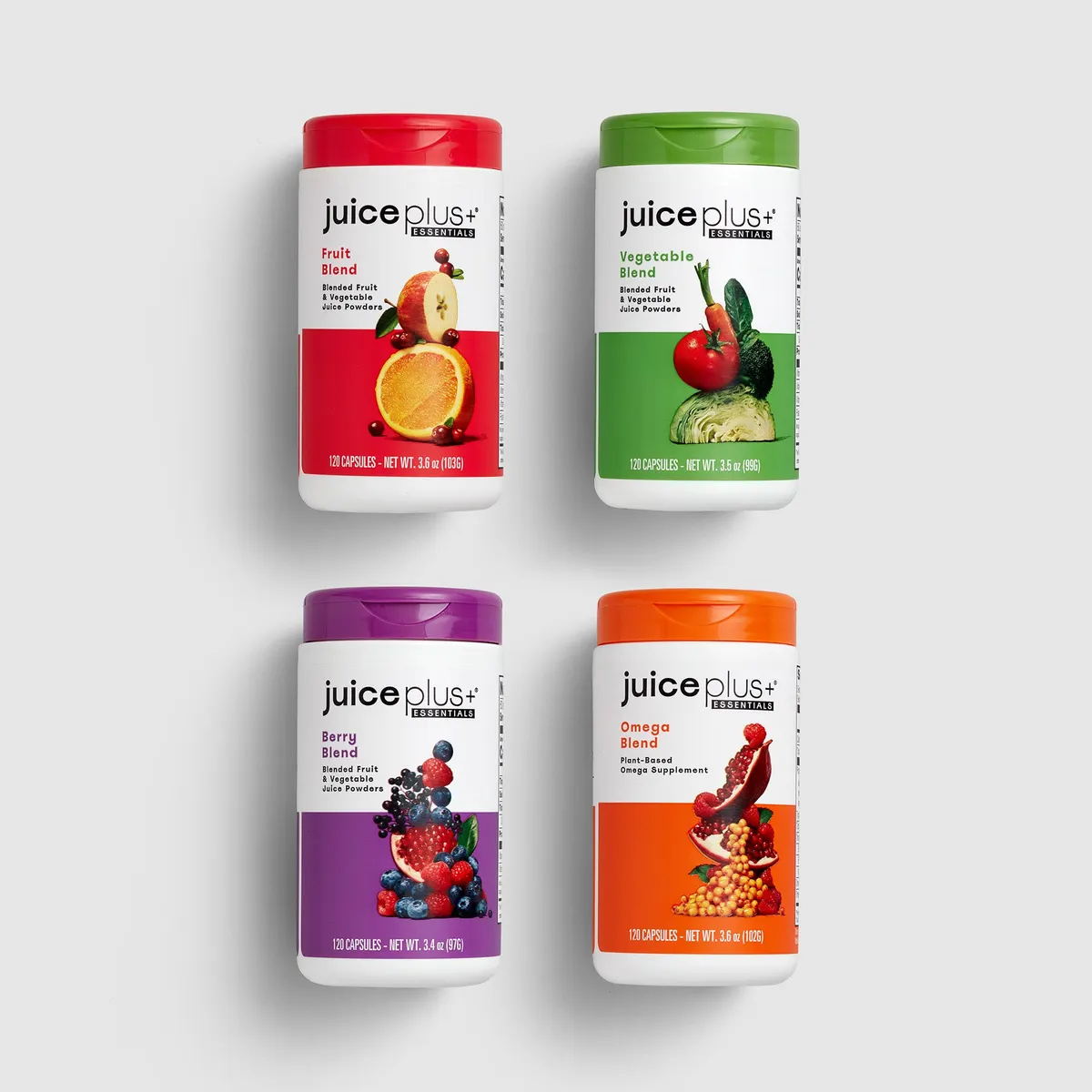 Four Juice Plus+ Essentials Capsules supplement on a white background
